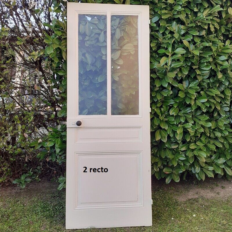 Eight old communication doors, solid and glazed, made of solid wood.