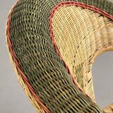 Rattan and wicker cabriolet-style armchair with green and red edging
