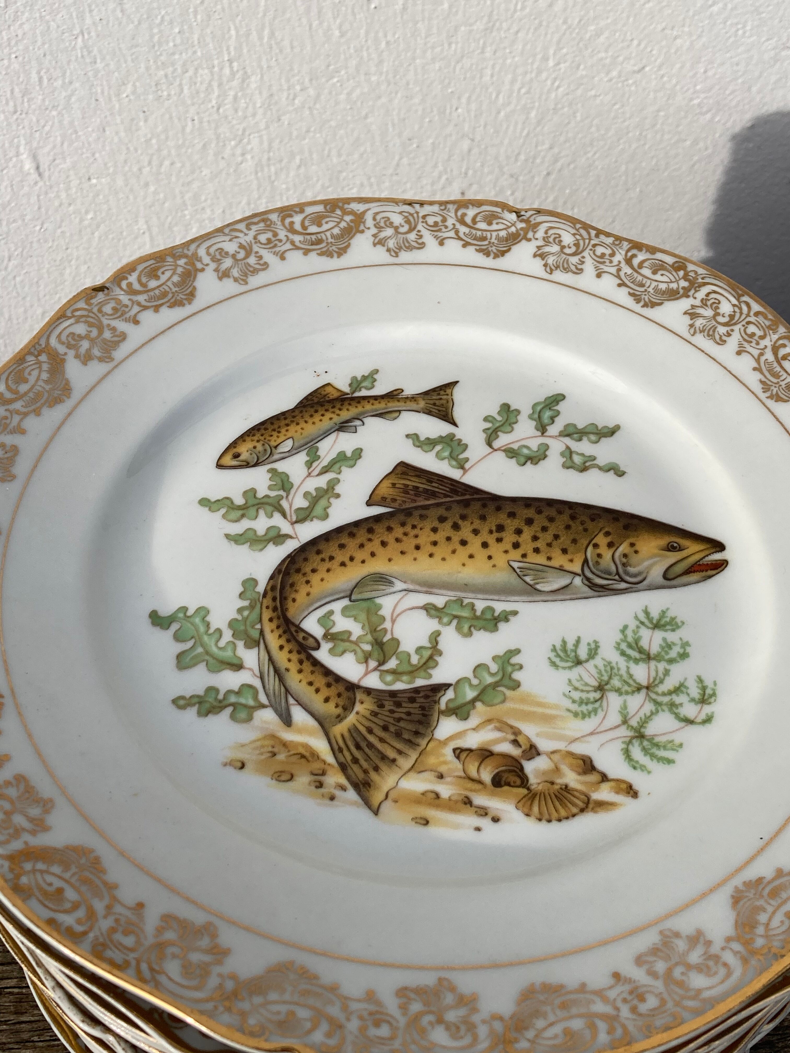 11 vintage Limoges porcelain fish plates