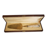 Silver pie server with Minerva hallmark.