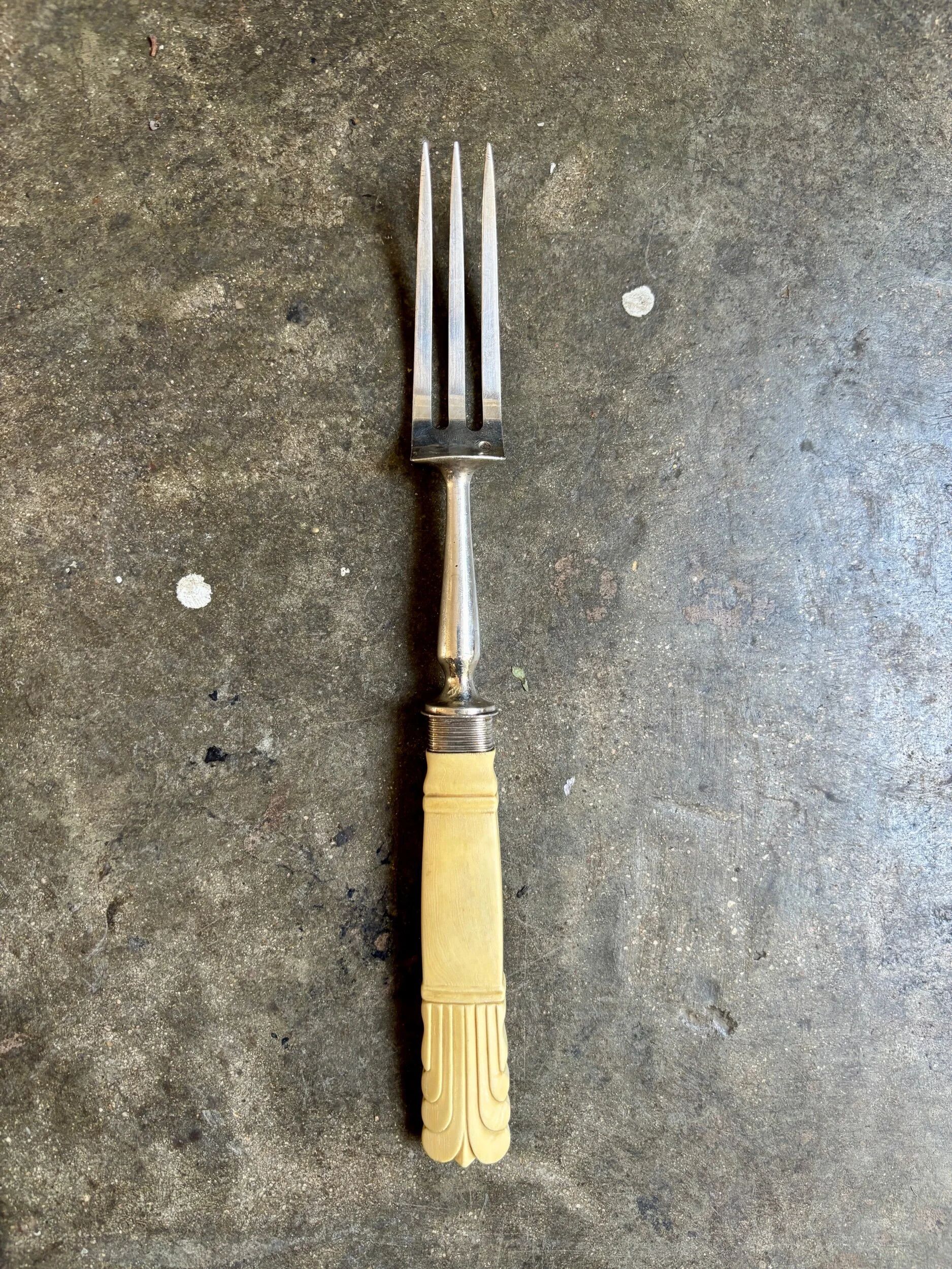Silver and bone serving fork