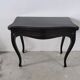 Molded blackened wooden play table, arched legs, green felt