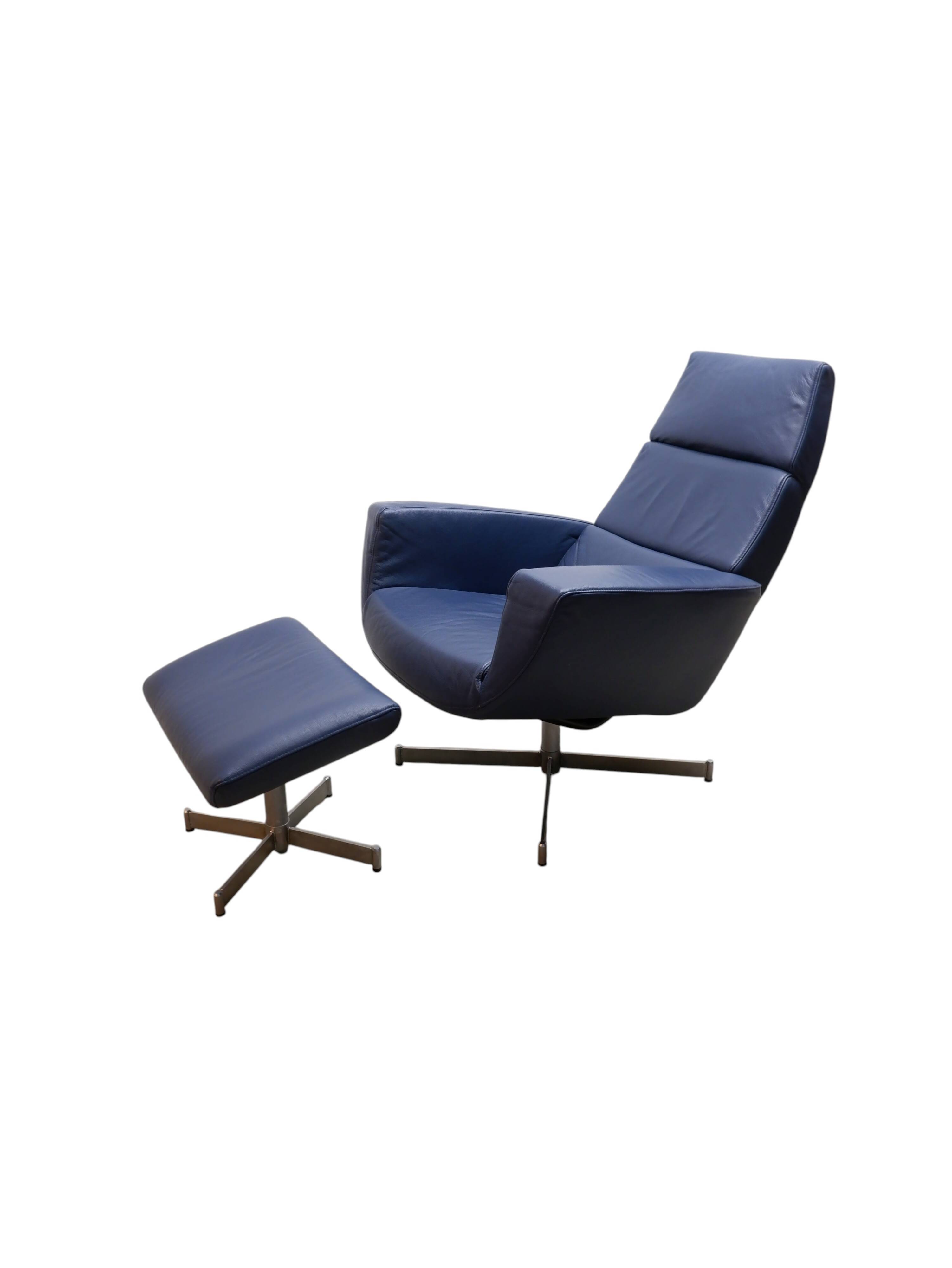 Leather arm chair with footstool