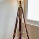 Vintage wooden and brass tripod lamp in marine style.