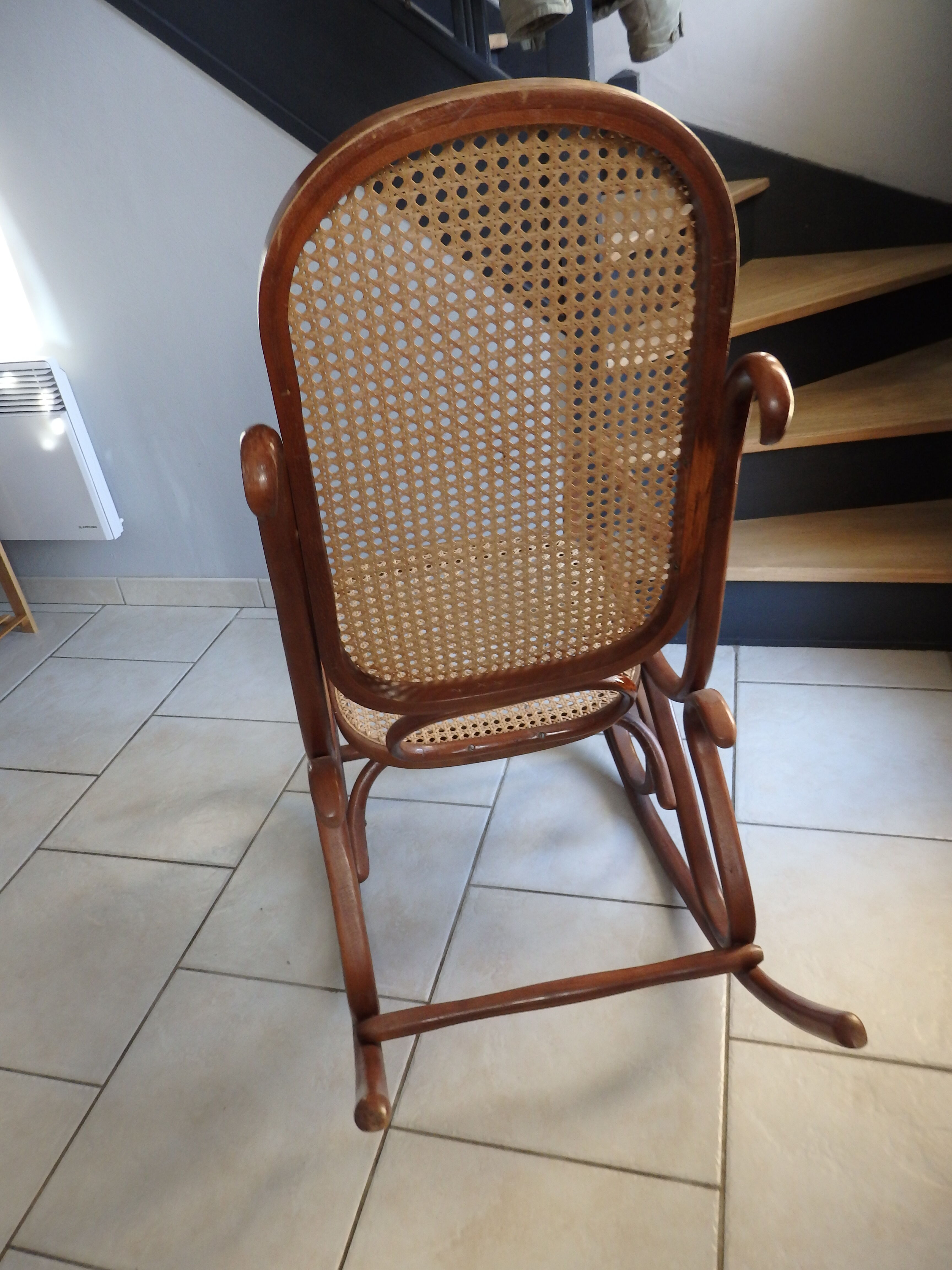 Rocking-chair in turned wood and cannage