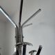 Chrome parrot coat rack with swivel head on a gas lift.