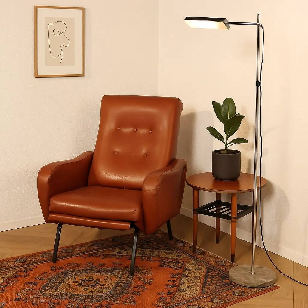 Vintage armchair from the 1970s in foam, faux leather, and metal.