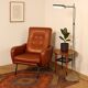 Vintage armchair from the 1970s in foam, faux leather, and metal.