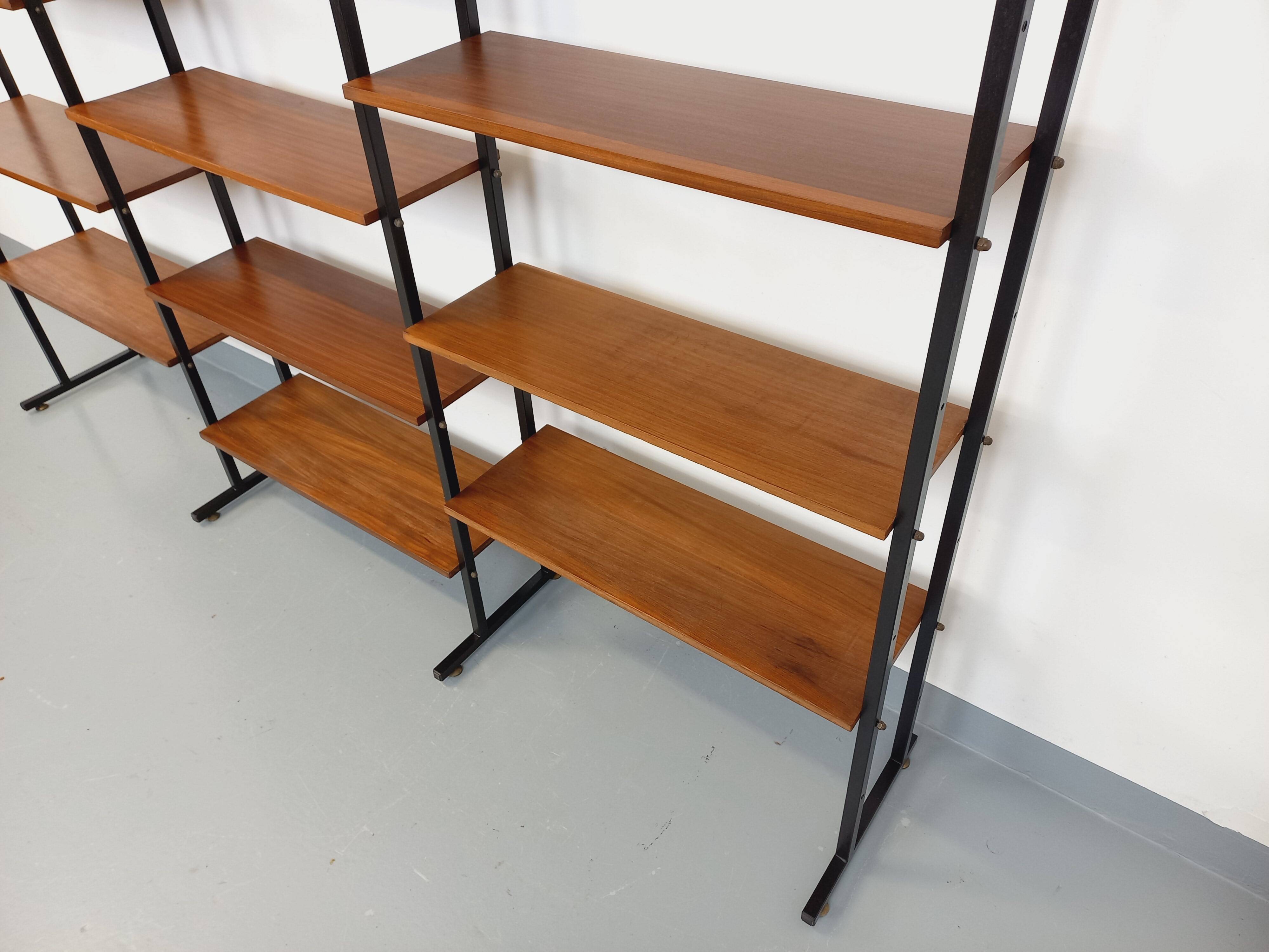 Vintage Italian triple modular bookshelf in teak and metal.