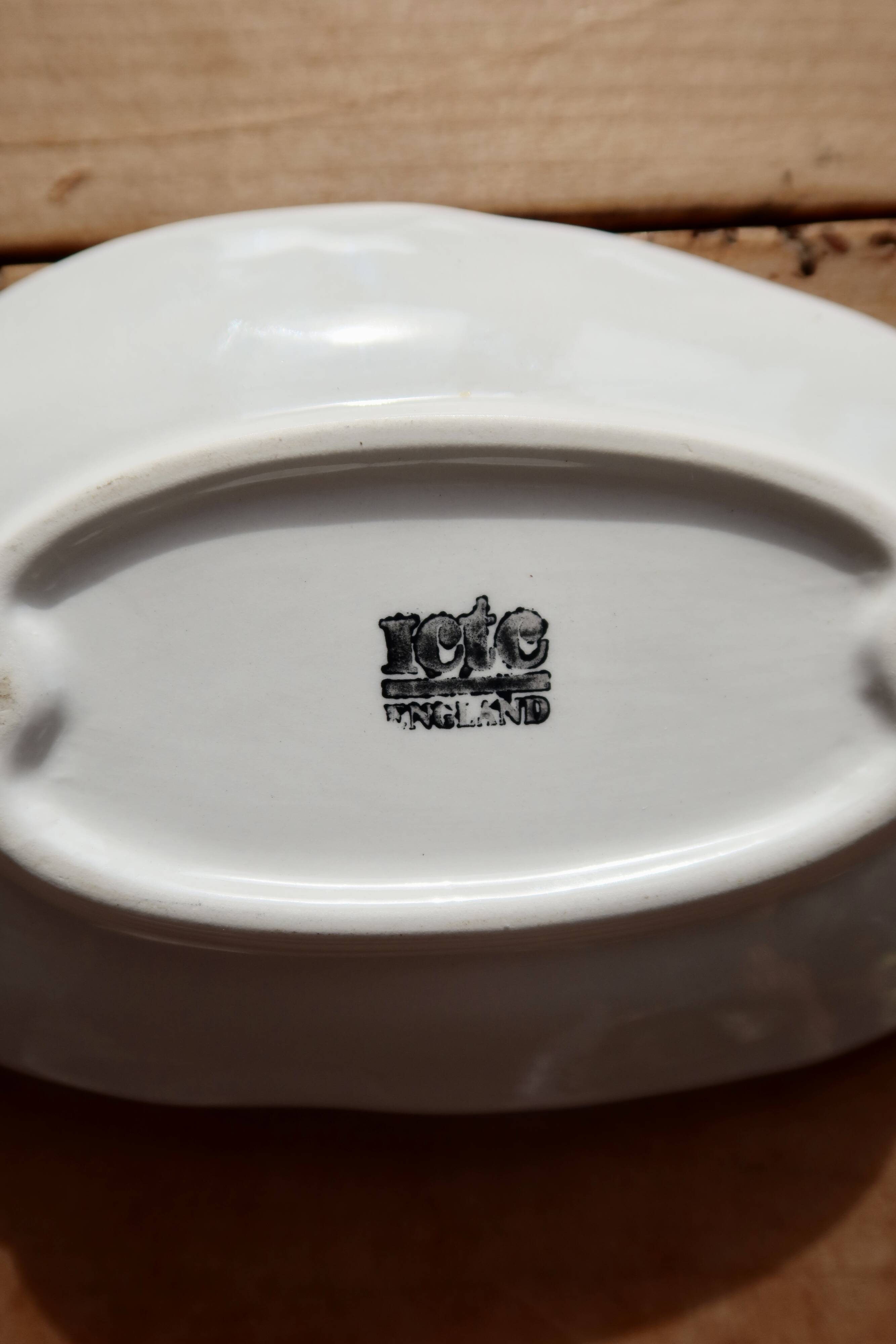 Antique leaf-shaped white English slipware dish.