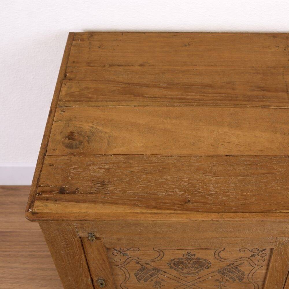 Oak side cabinet with carved motifs