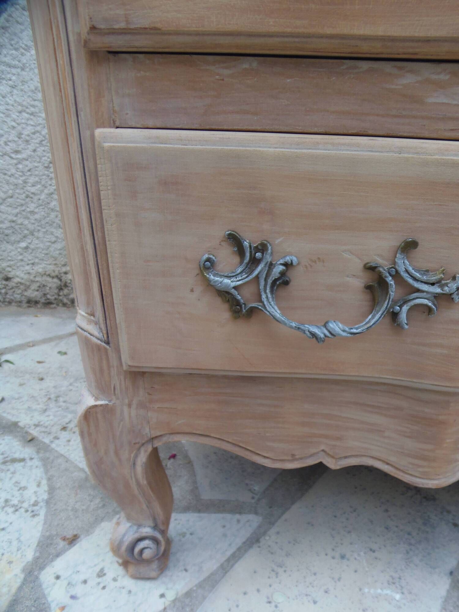 Beautifully crafted Louis XVI style commode in bleached wood.