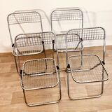 4 chrome folding chairs by Talin Cornedo