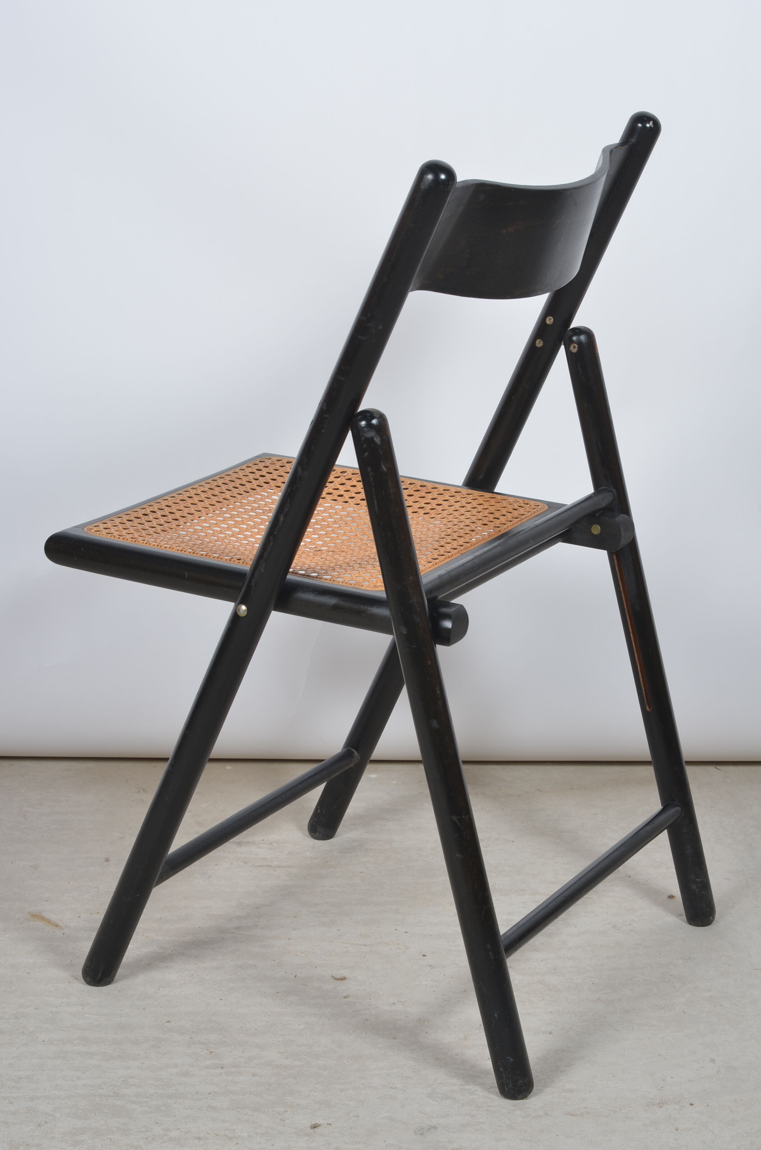 Folding chair seated in cannage