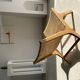 Reclining armchair in natural wood and woven rattan