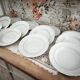 12 deep plates in porcelain with double gold trim.
