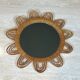 Rattan mirror representing a sun