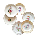 Flat earthenware plates with gilded edges