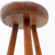 Brutalist tripod stool in solid wood, around 1960.
