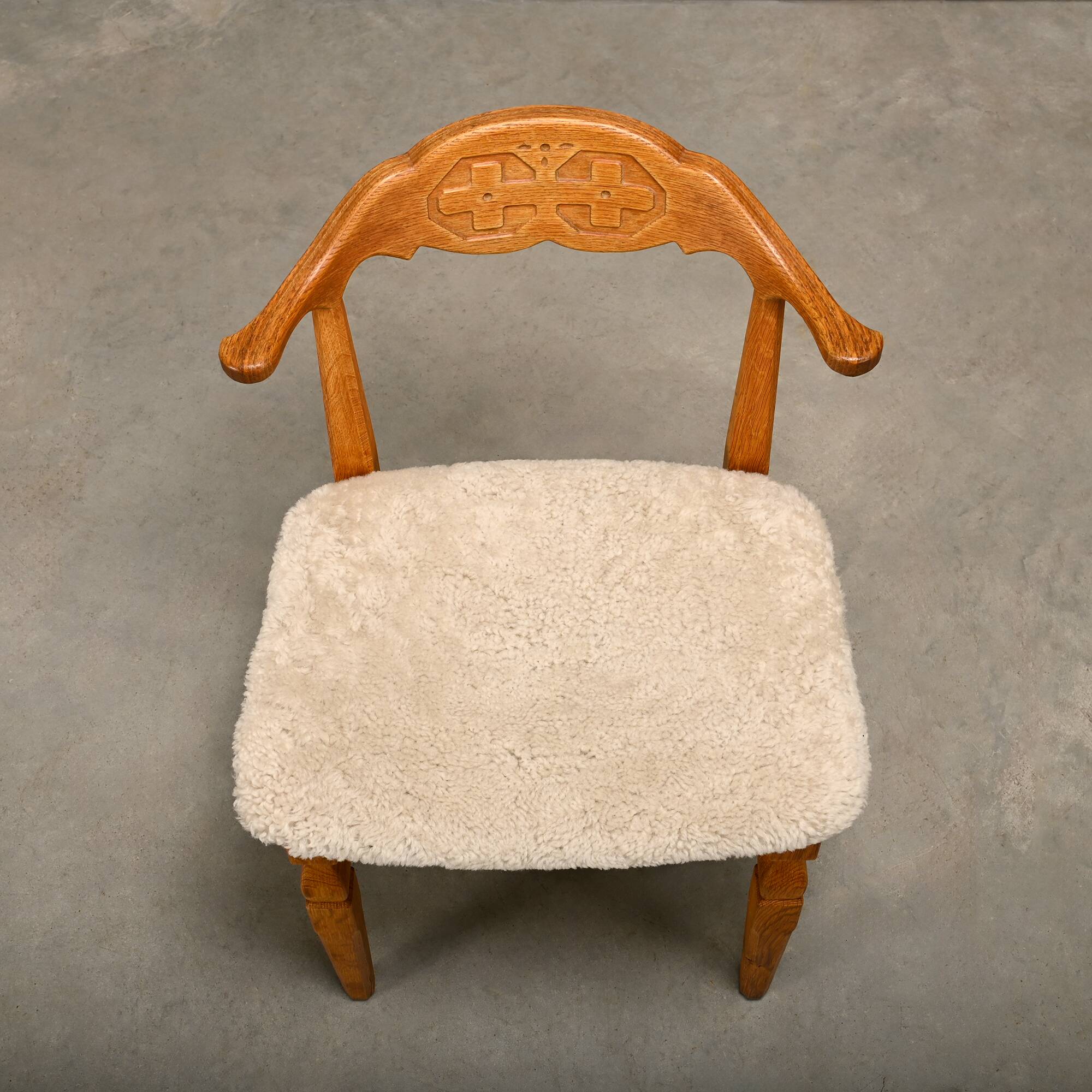 Henning Kjærnulf brutalist dining chairs set in Oak and Sheepskin, Denmark