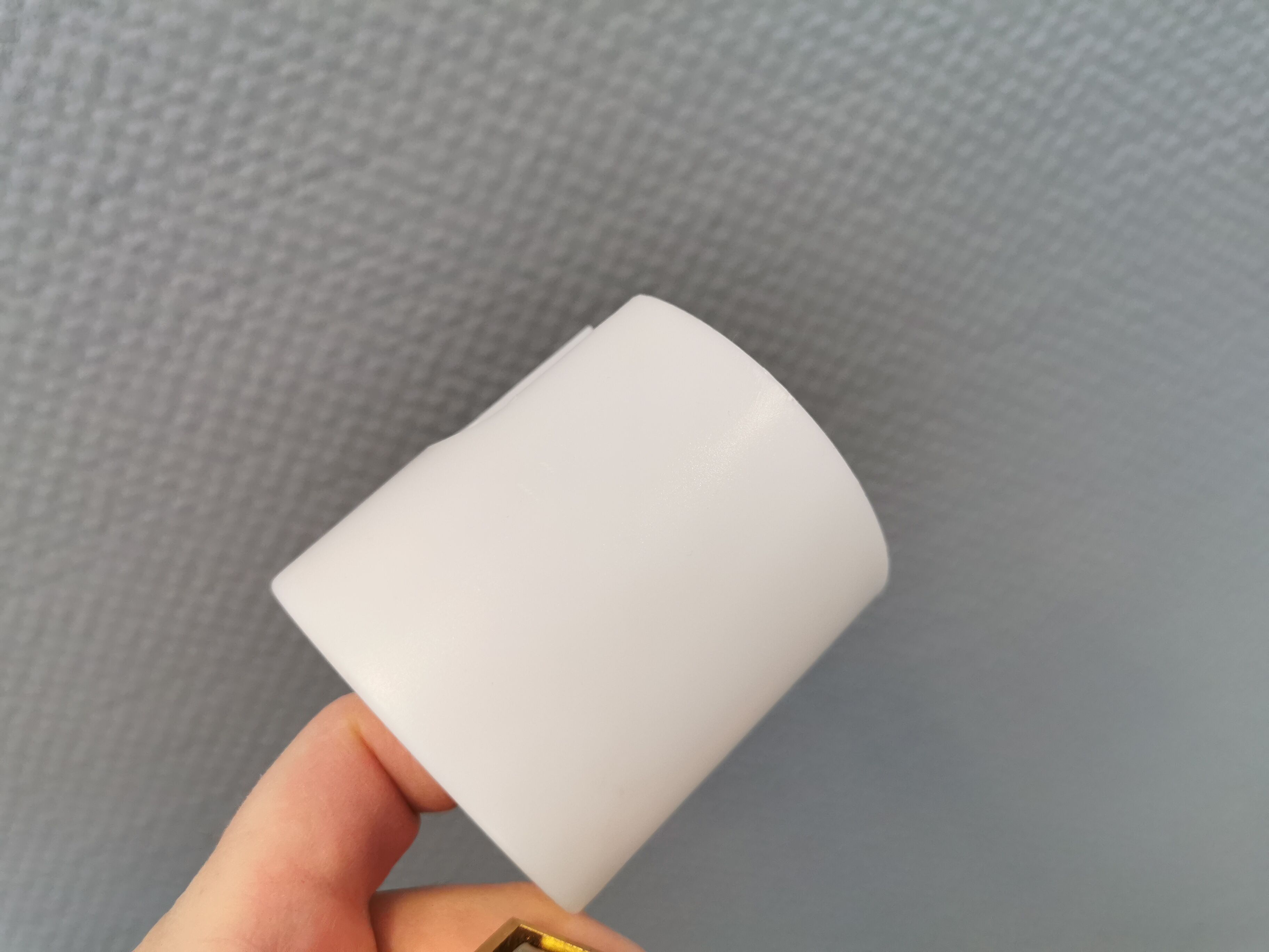 Wall lamps with milky white acrylic plastic shades and solid brass bases