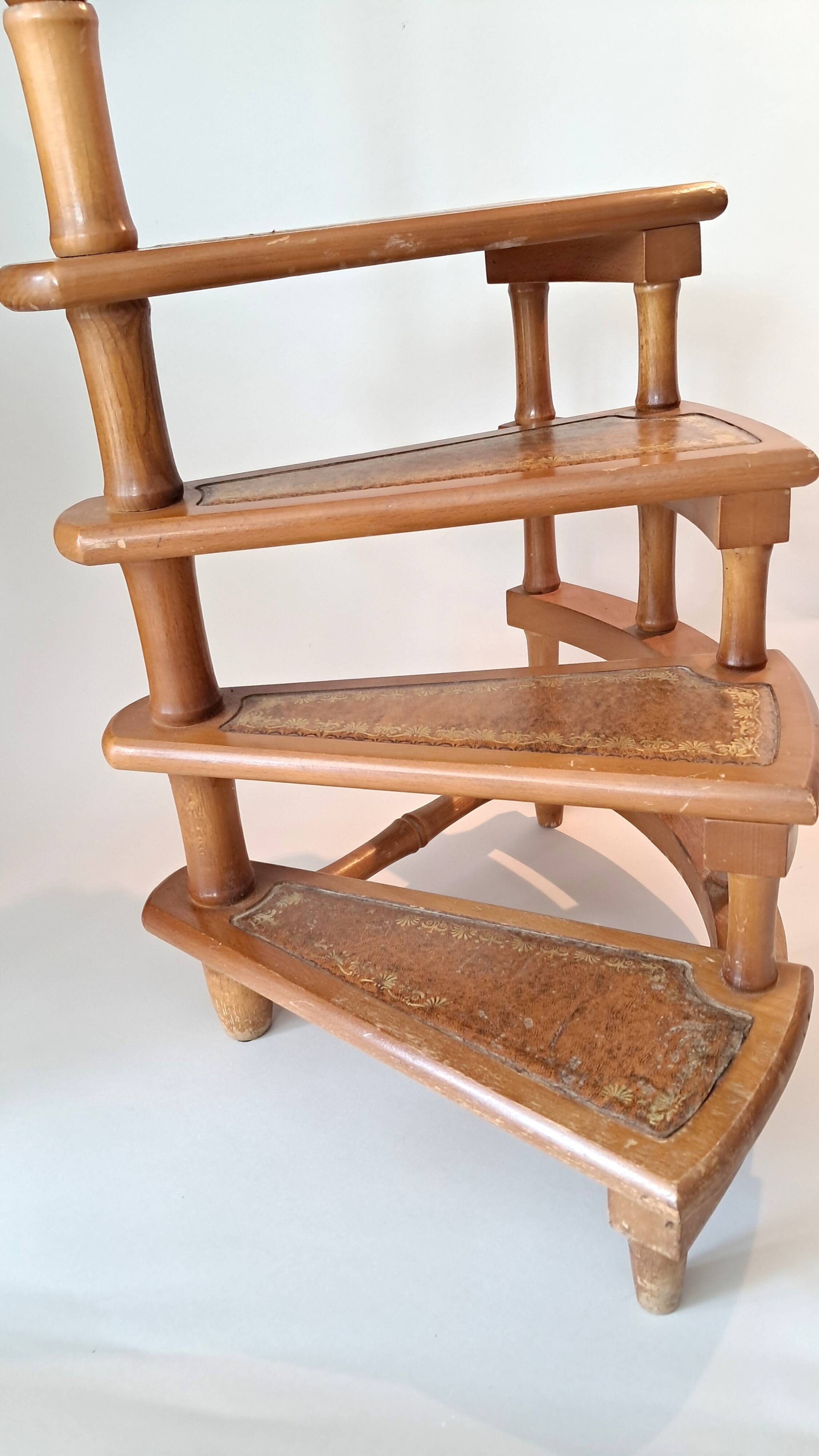 Library spiral staircase in beech and brown leather.