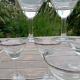 11 bottle-bottom bistro glasses with silver edging, early 20th century