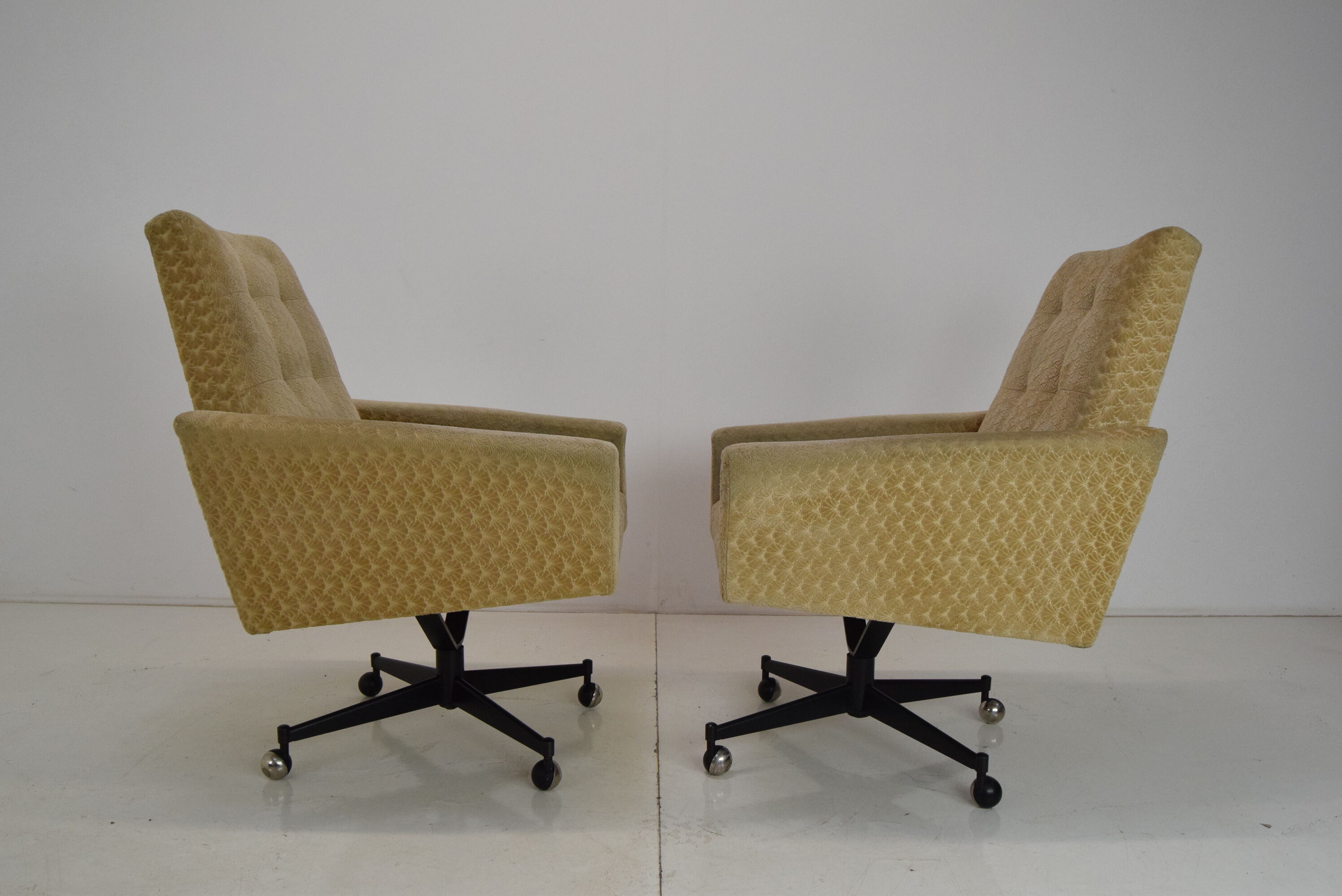 Pair of mid-century swivel armchairs with wheels 1970's