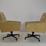 Pair of mid-century swivel armchairs with wheels 1970's
