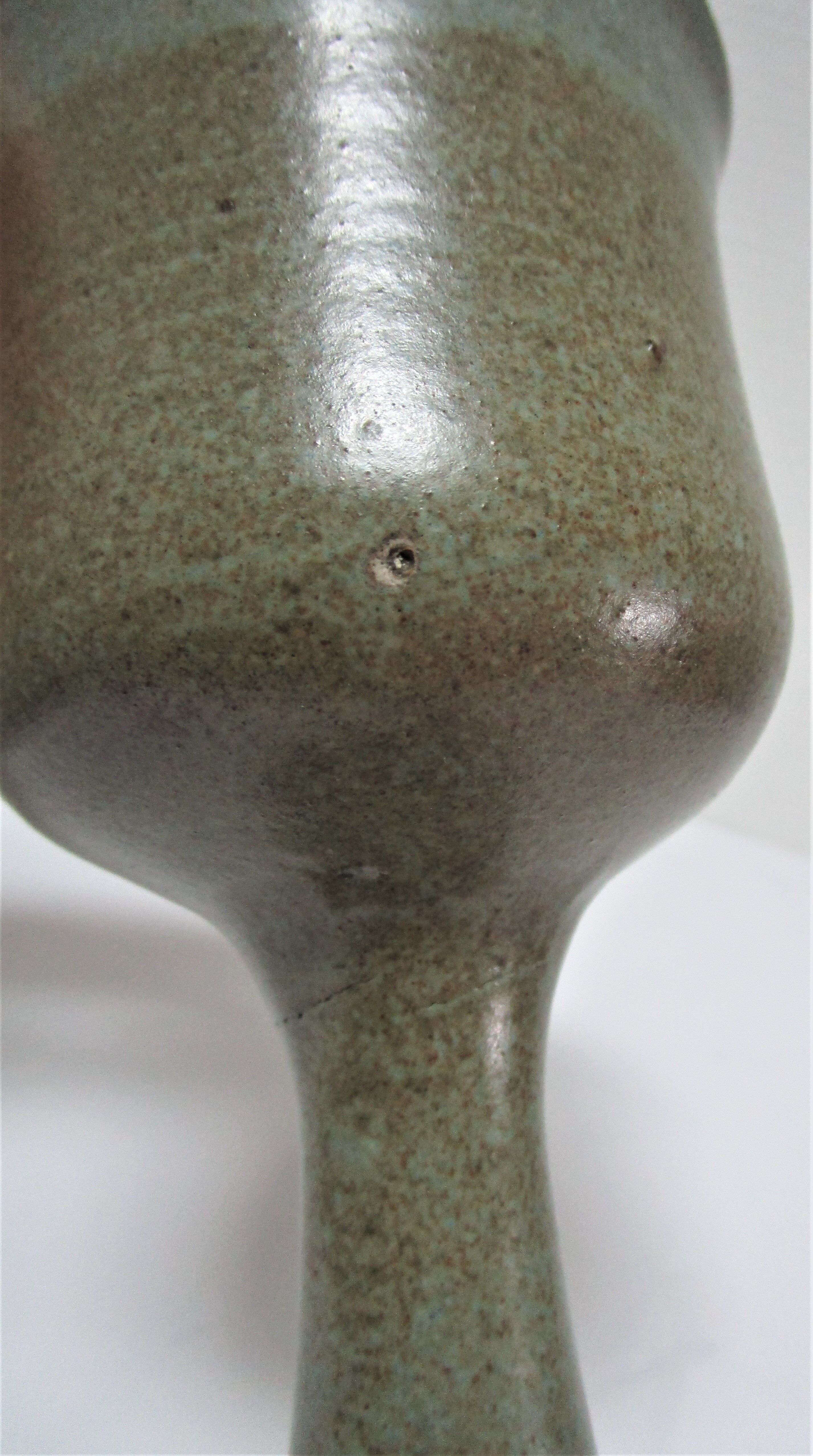 Two enamelled ceramic walking glasses