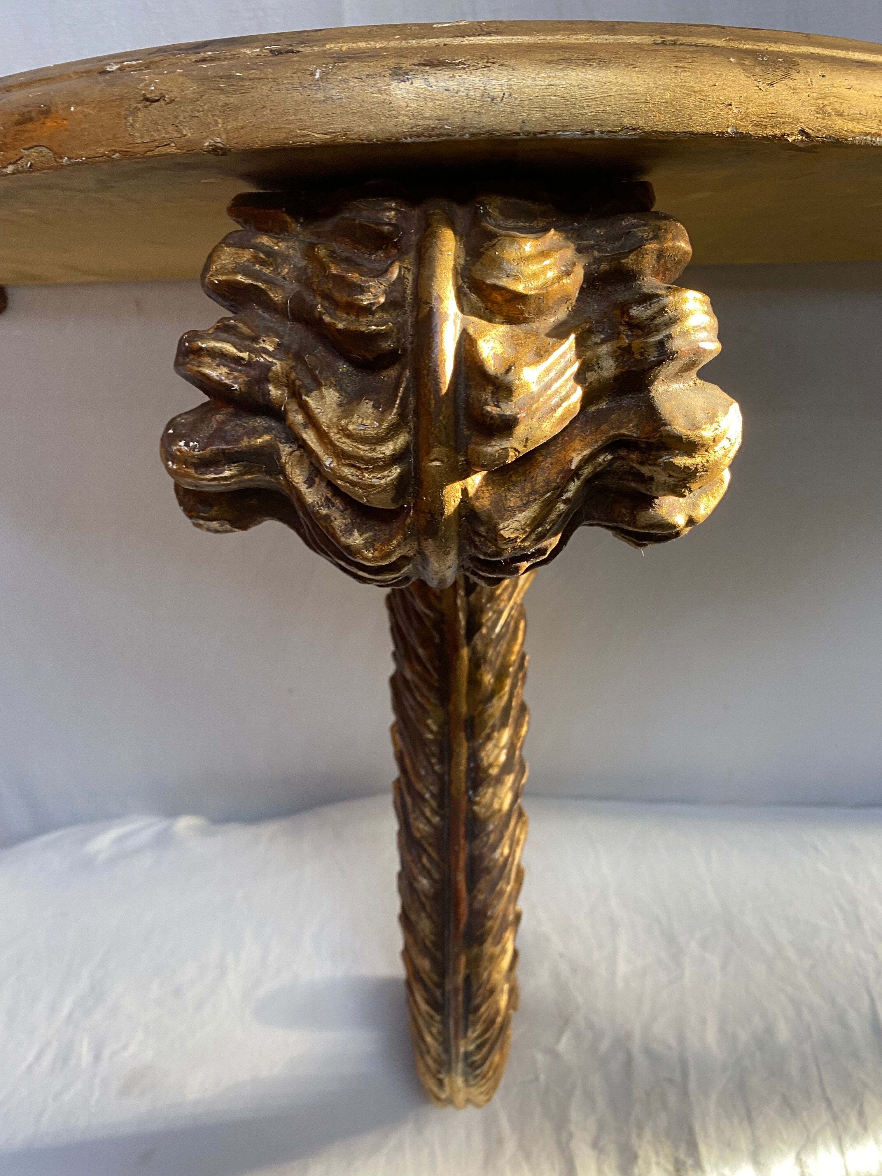 Wooden wall console and antique gilded stucco