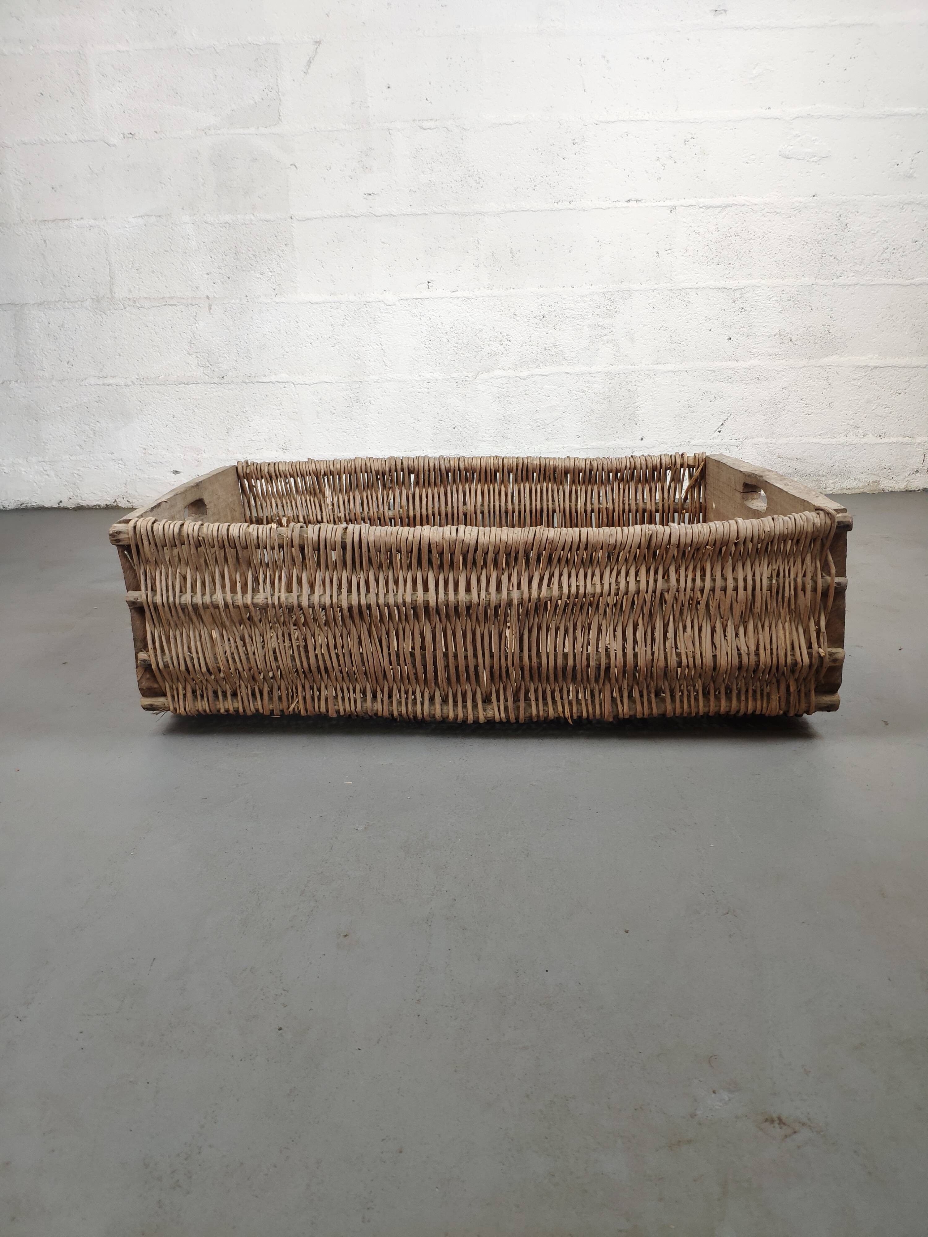 Set of 2 old large baskets with logs wood and wicker