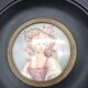 Miniature on ivory. Young woman with a flowery hat