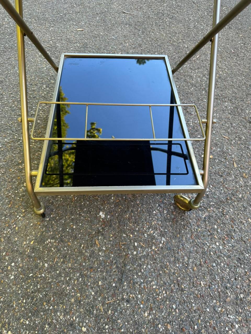 Mid-Century 1978 brass and black smoked glass wheeled dessert trolley.