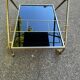 Mid-Century 1978 brass and black smoked glass wheeled dessert trolley.