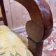 Pair of 19th-century armchairs with a scrolled back