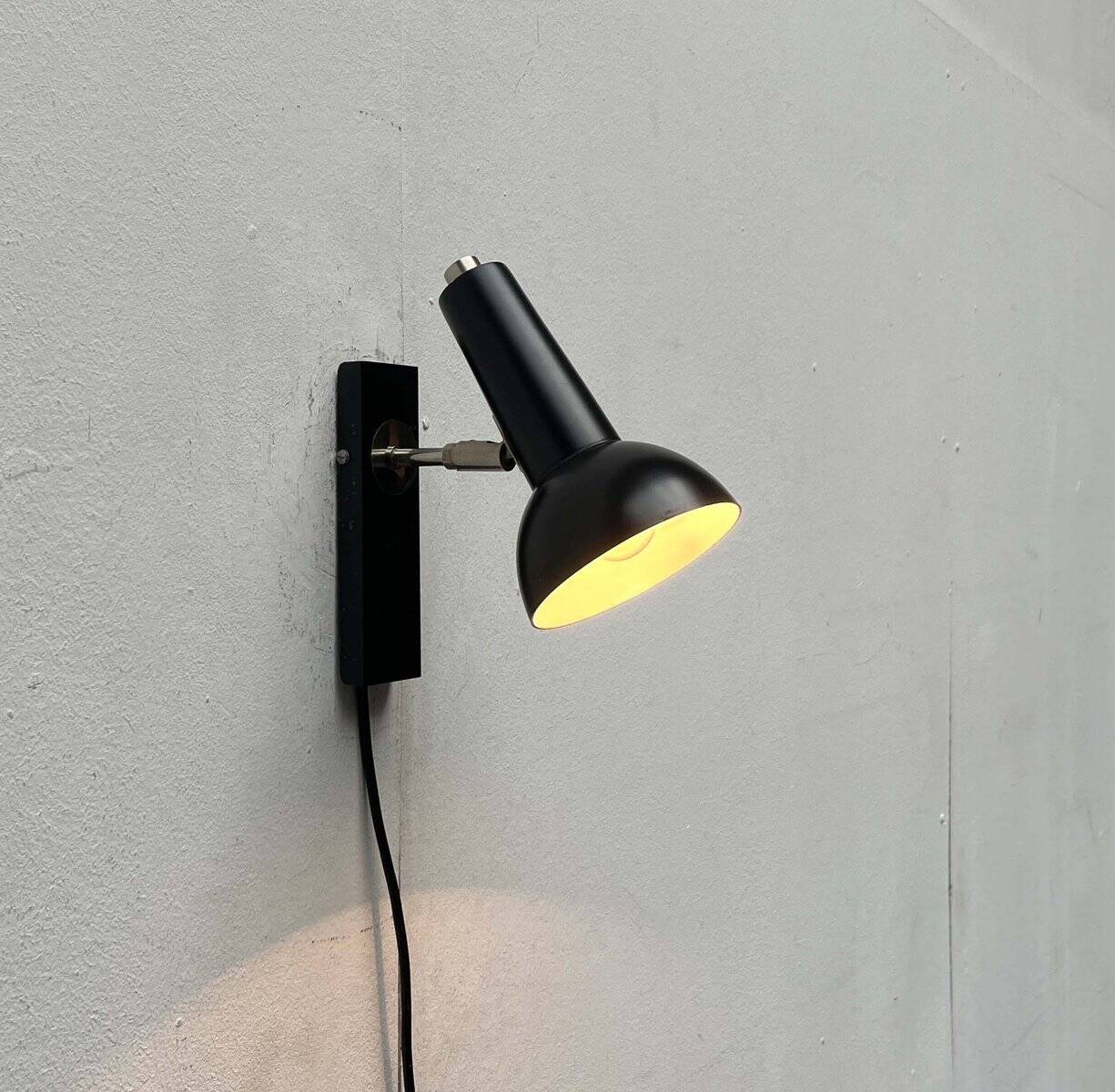 Mid-century German black minimalist wall lamp by Hustadt, 1960s.