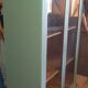 Green patina wooden display cabinet