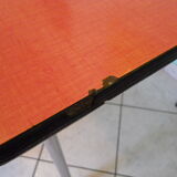 Table in red formica, 4 roc chairs, 2 extension cords, 2 drawers 60