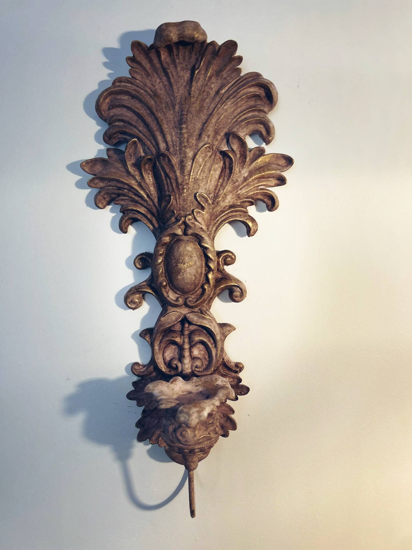 Incredible patinated wall candle holder