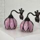 Pair of Tiffany style iron and glass leg wall lights