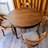 Round cherry table with extension, 3 chairs and 1 armchair.