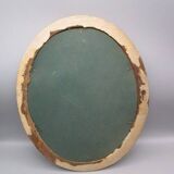 Old oval frame in wood and gilded stucco
