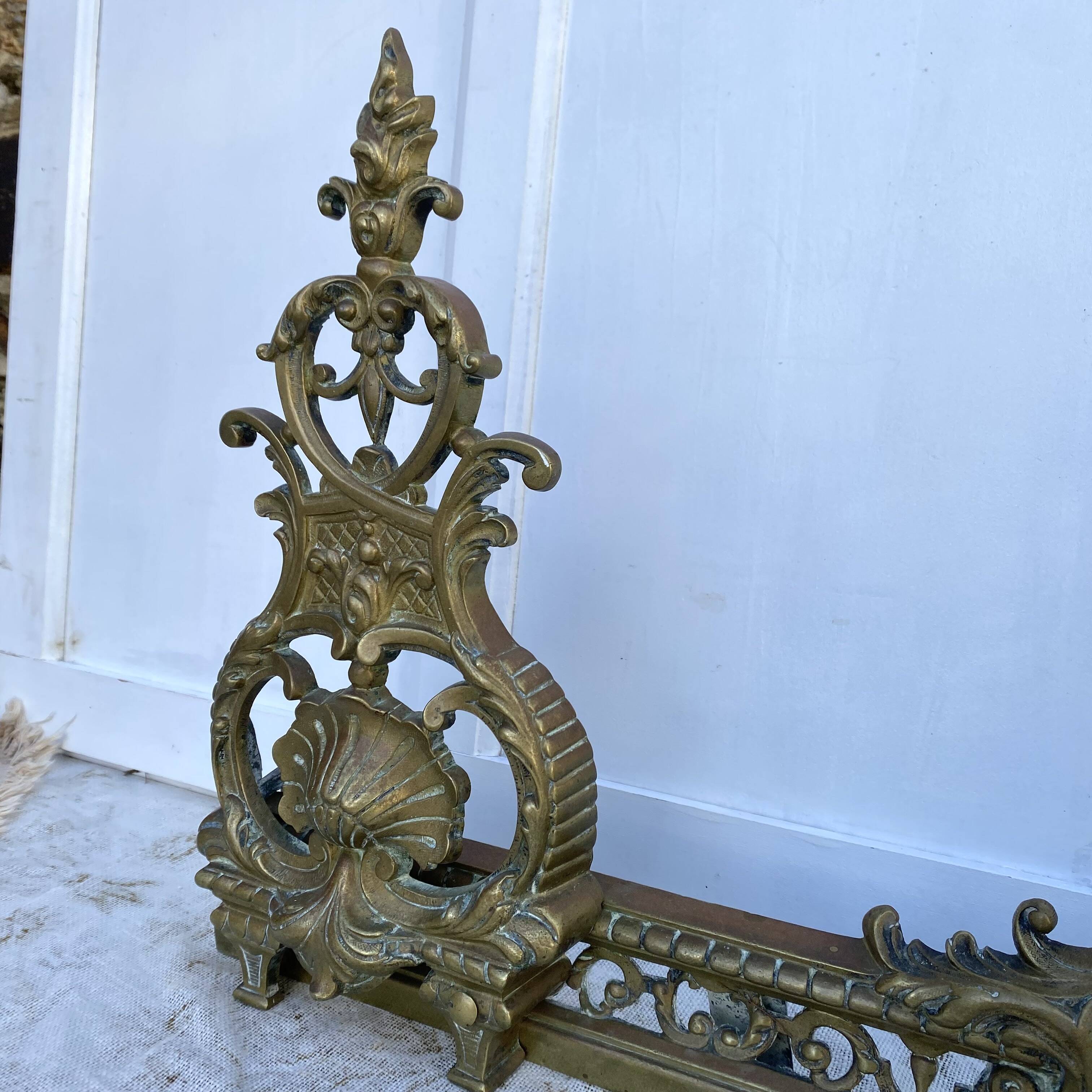 Antique brass fireplace set, bar and andirons, Napoleon I style.