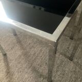 Pair of nesting tables in chromed metal and glass