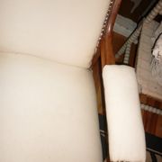 Armchair and its footrest