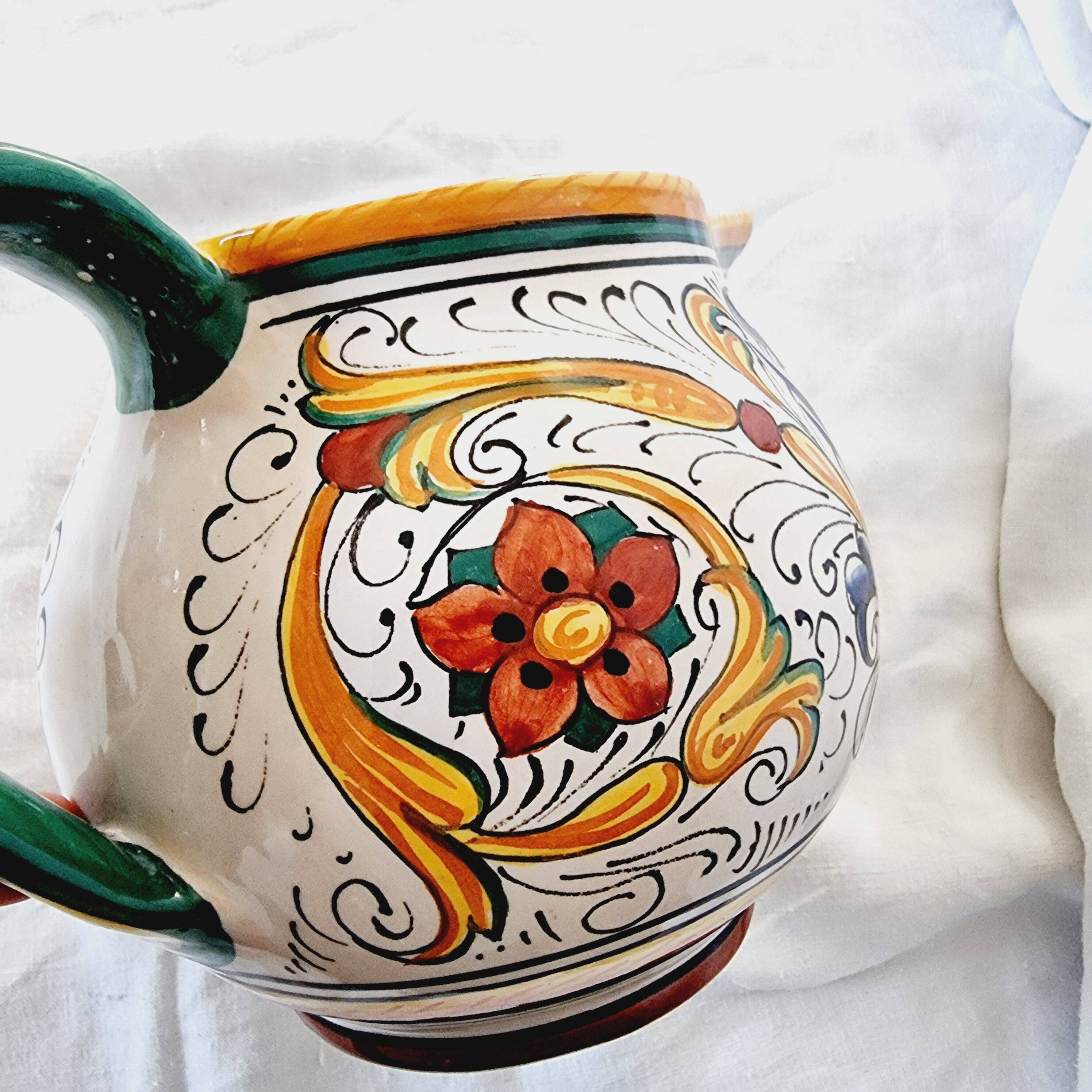 Majolica ceramic jug by R. Deruta, Italy, hand-painted, with a long spout.  Decorated with a dragon tree