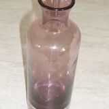 Plum-colored glass bottle with bubble