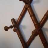 1900 accordion coat holder