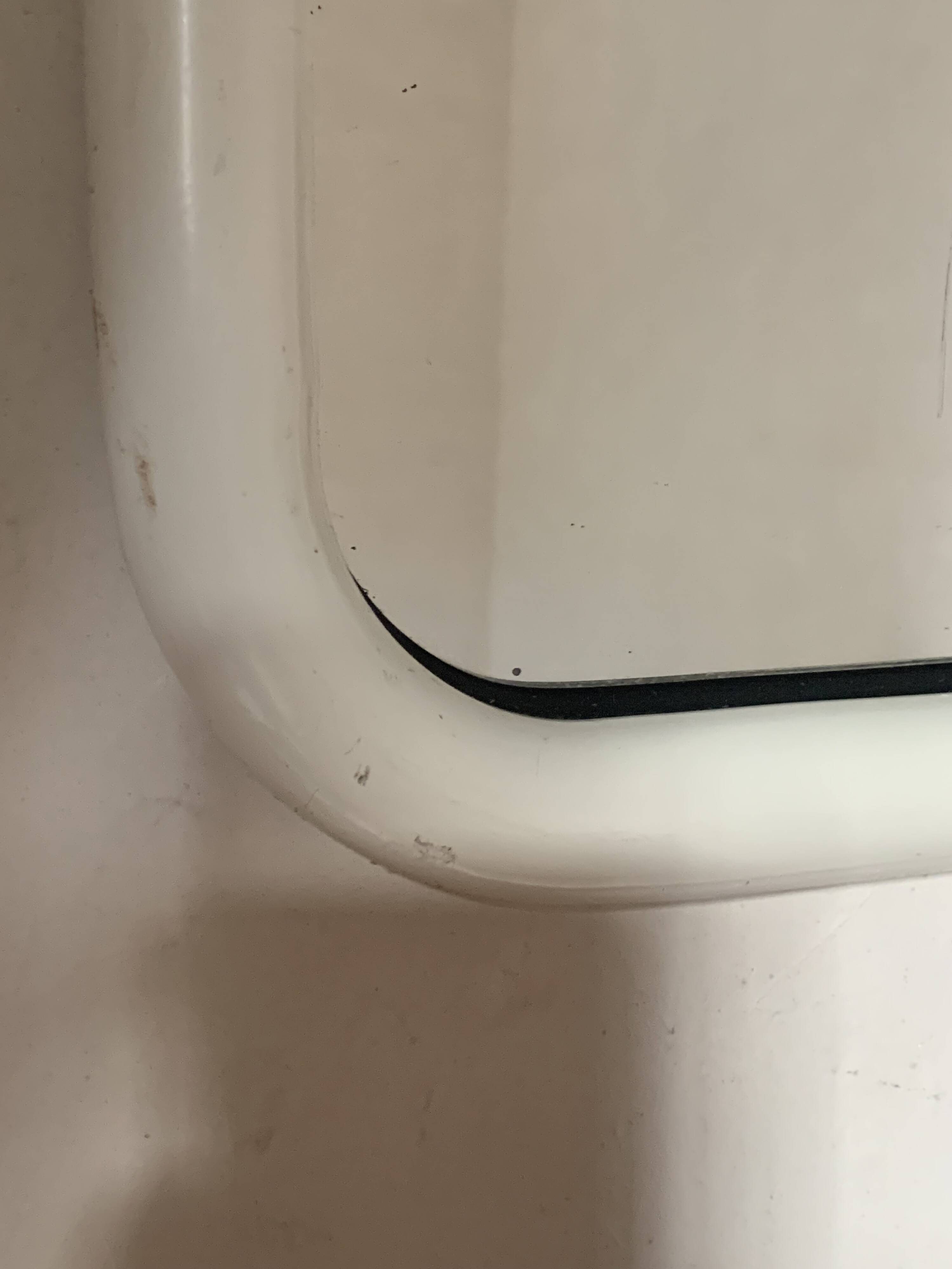 White tubular metal wall mirror